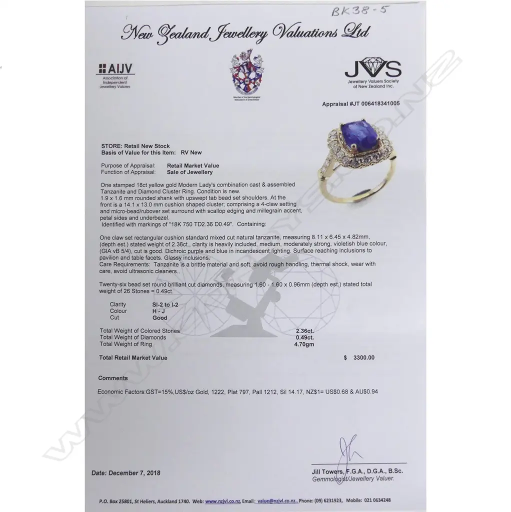 An 18ct. gold tanzanite and diamond ring Image 1++