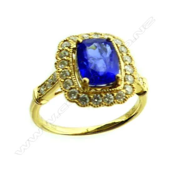 An 18ct. gold tanzanite and diamond ring
