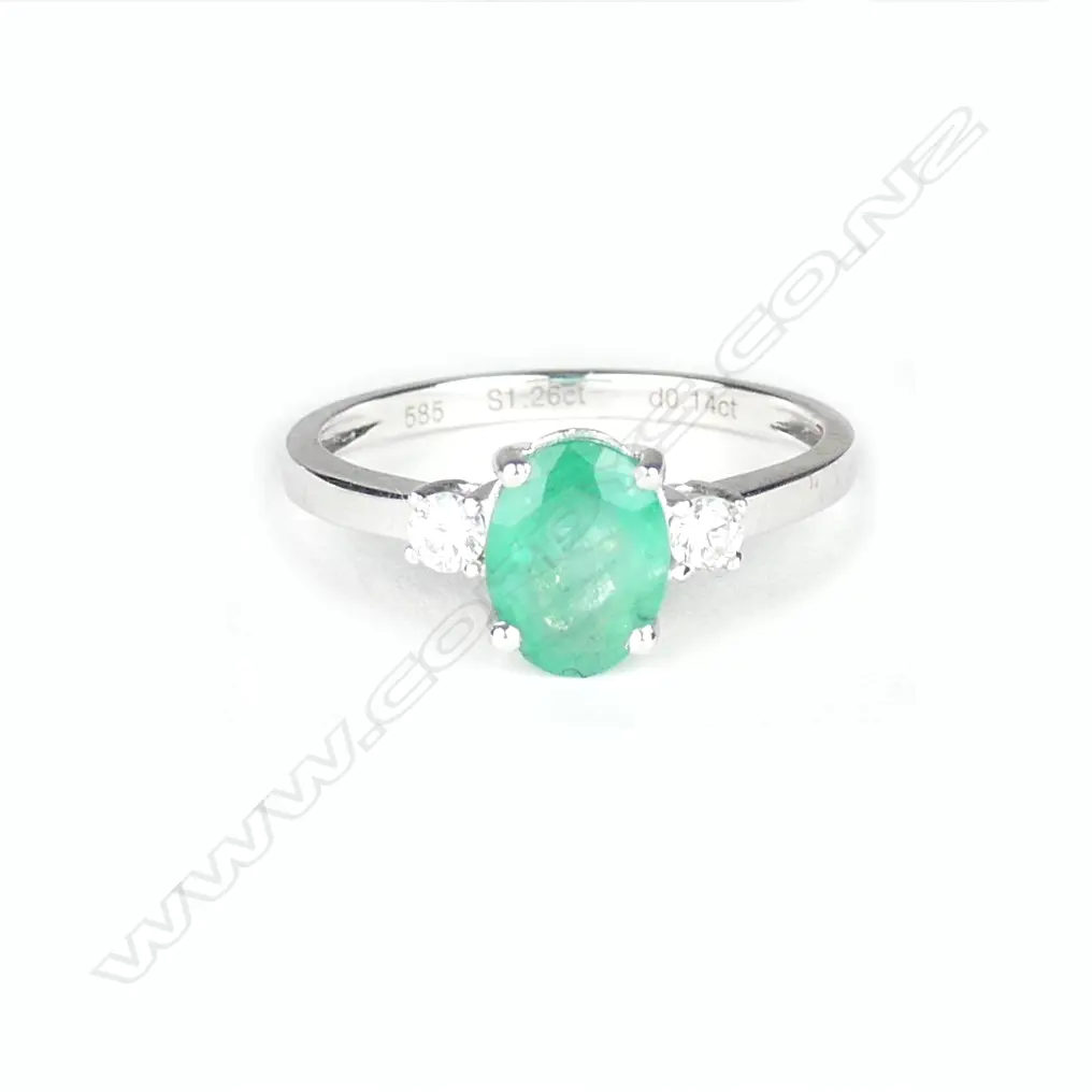 A 14ct. white gold emerald and diamond ring Image 1++