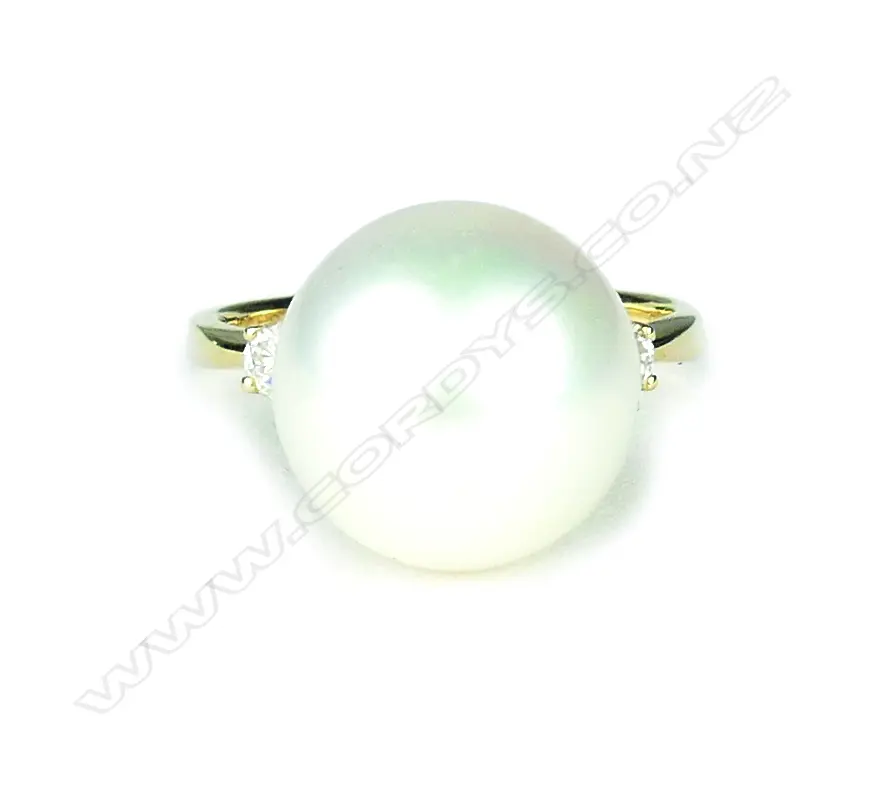 A 14ct. yellow gold pearl and diamond ring Image 1++
