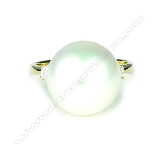 A 14ct. yellow gold pearl and diamond ring