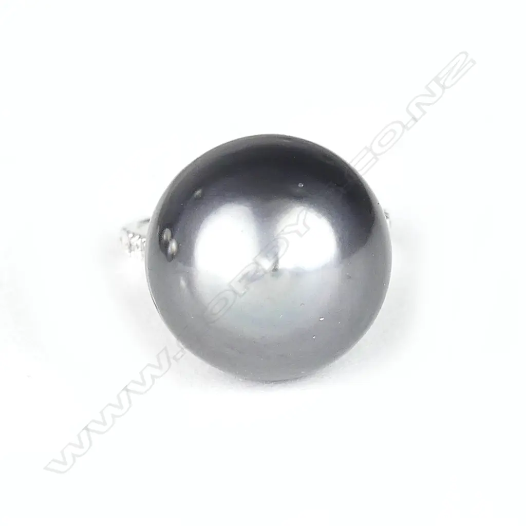 A 14ct. white gold pearl and diamond ring Image 1++