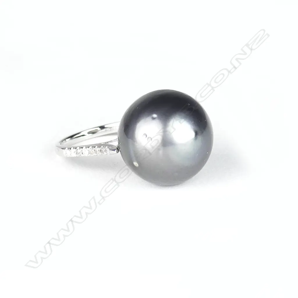 A 14ct. white gold pearl and diamond ring Image 1++
