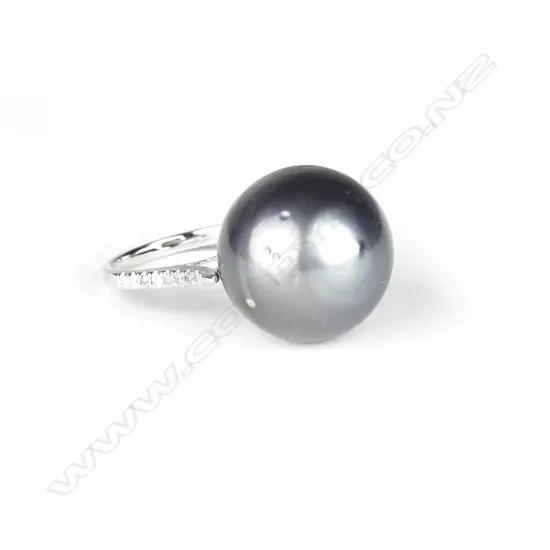 A 14ct. white gold pearl and diamond ring