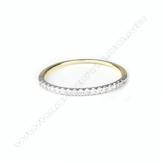 An 18ct. gold and diamond set band