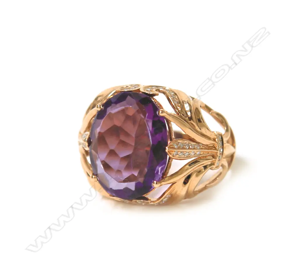 An 18ct. rose gold modern large amethyst and diamond dress ring Image 1++