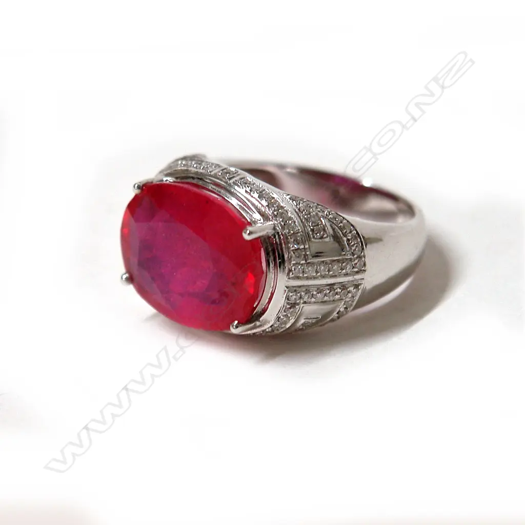 An 18ct. white gold large ruby and diamond modern dress ring Image 1++