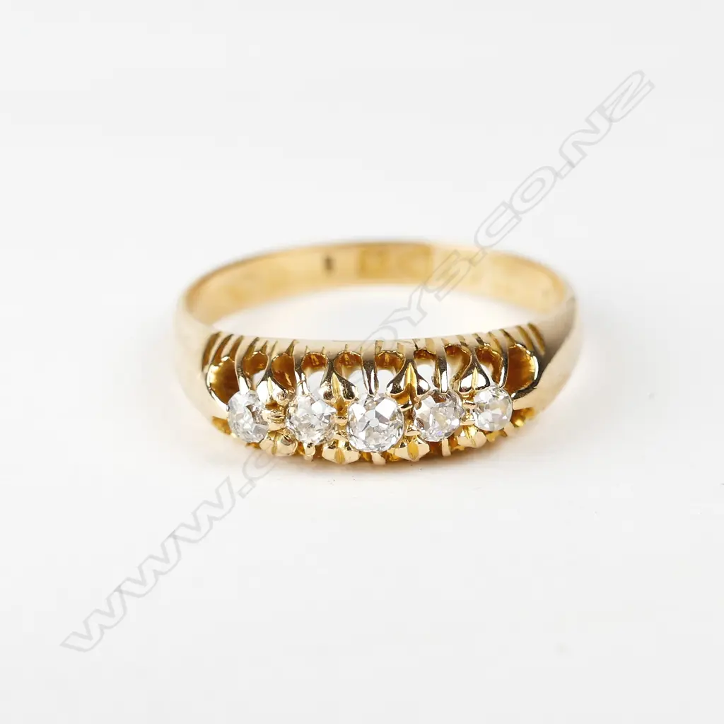 An estate 18ct. yellow gold and diamond bridge ring Image 1++