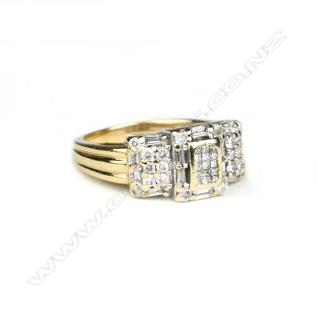 A 14ct gold and diamond ring Image 1++