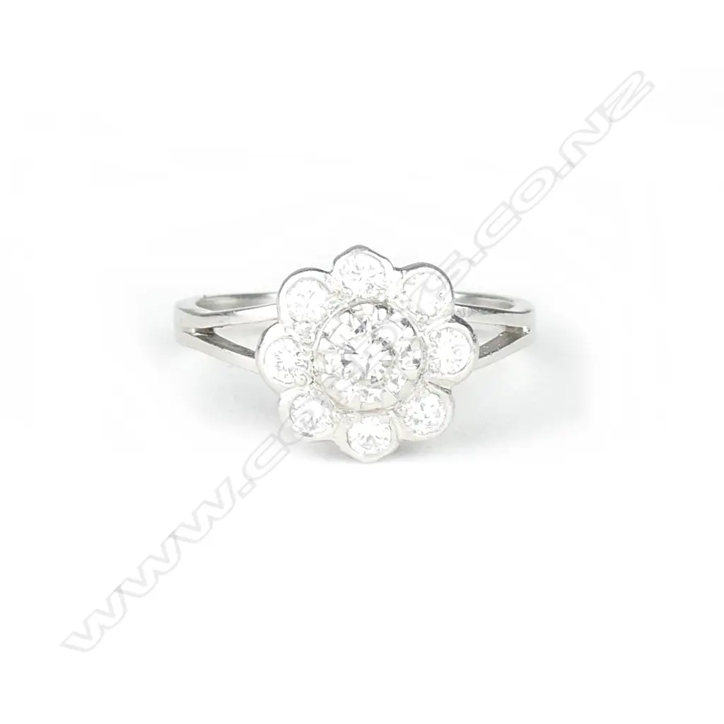 An estate platinum and diamond cluster ring Image 1++