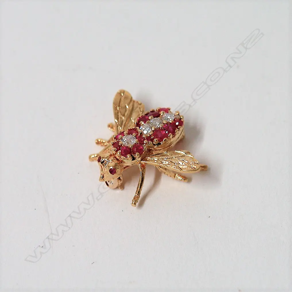 A modern Herbert Rosenthal 18ct. yellow gold ruby and diamond bee brooch Image 1++