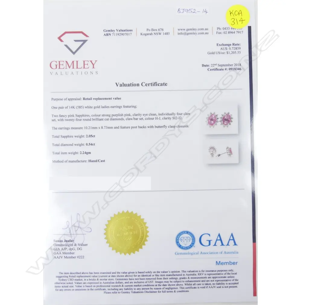 A pair of 14ct. white gold sapphire and diamond stud earrings Image 1++