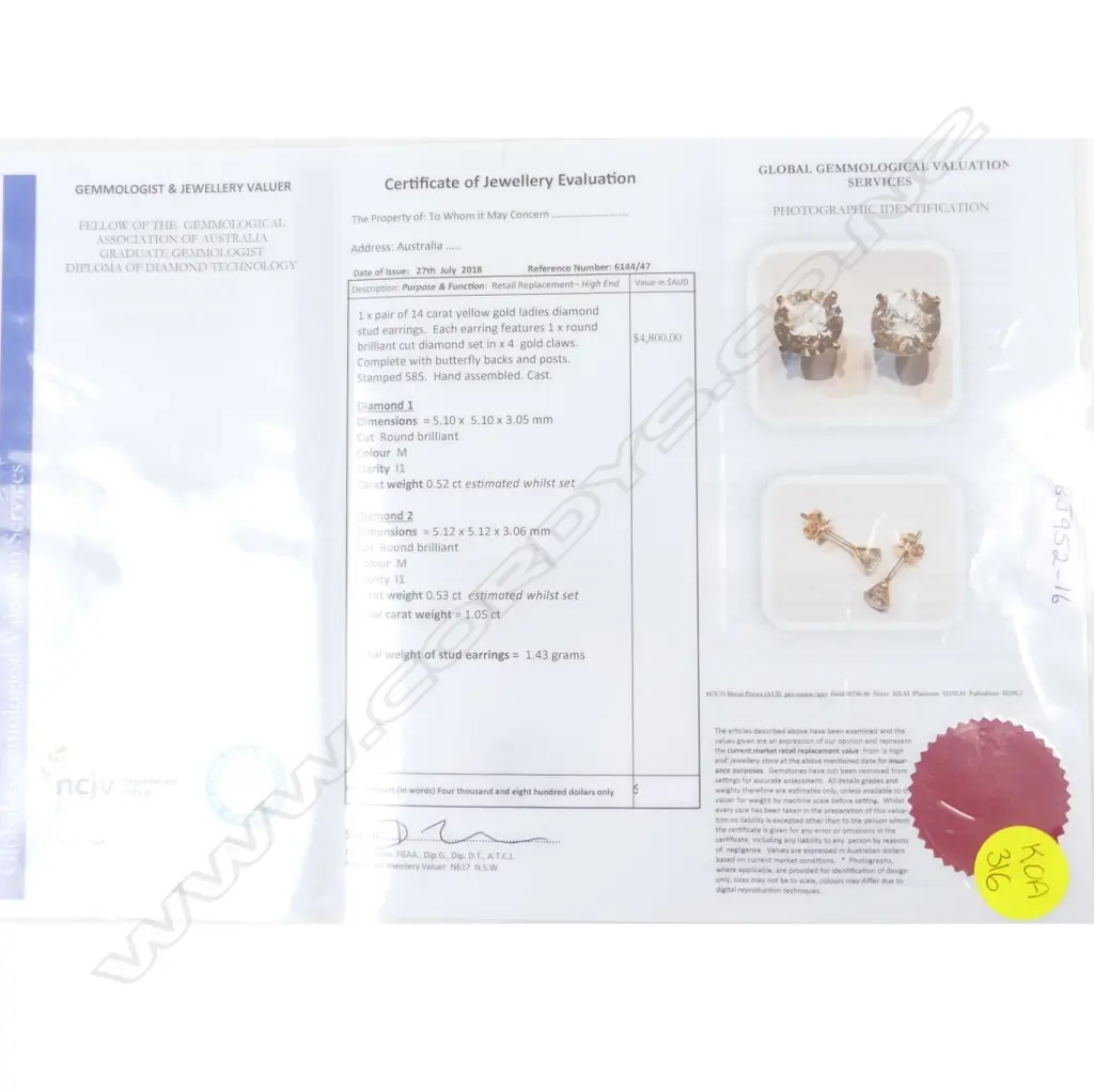 A pair of diamond stud earrings Image 1++