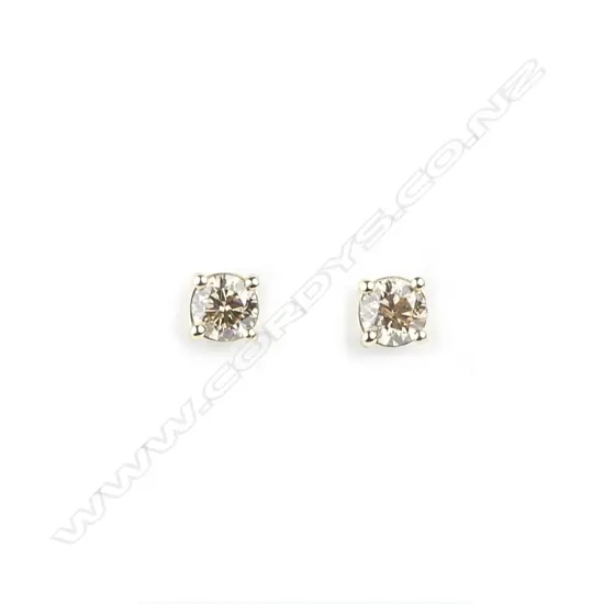 A pair of diamond stud earrings