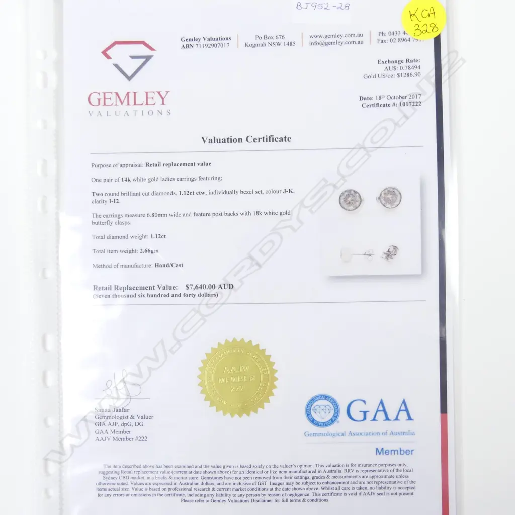 A pair of 14ct. white gold diamond stud earrings Image 1++