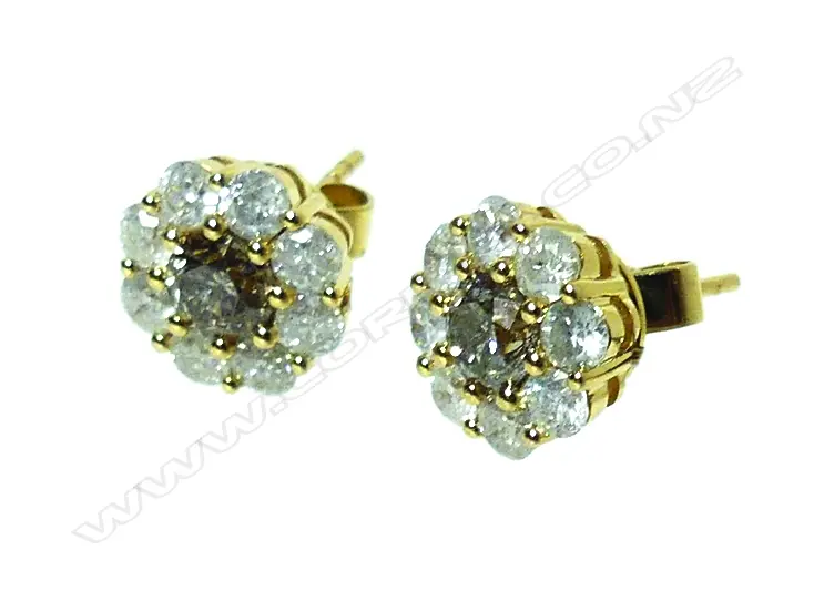 A pair of 18ct. gold and diamond stud earrings Image 1++