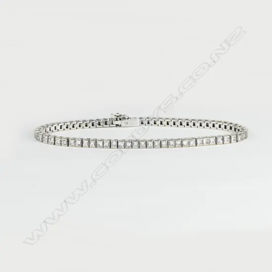 A 9ct. white gold and diamond tennis bracelet