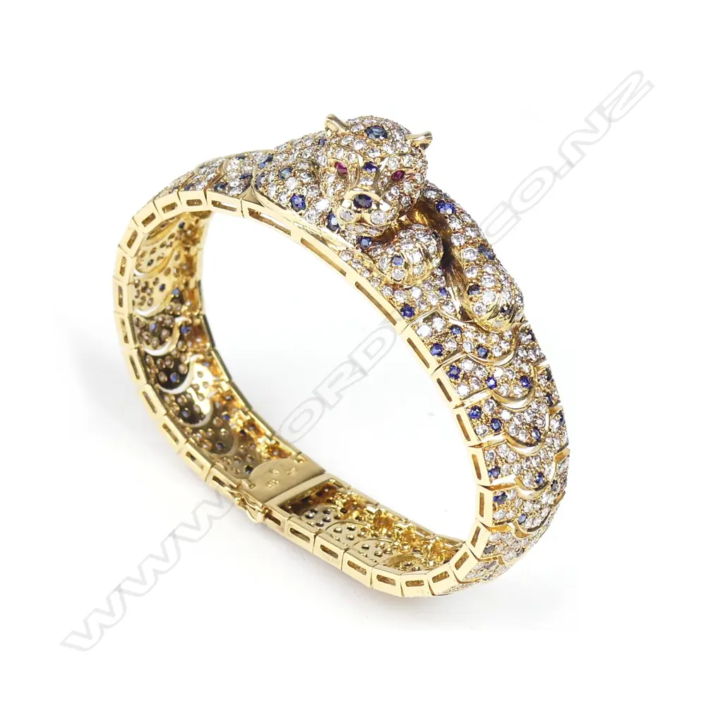 An impressive 18ct. gold diamond sapphire and ruby bracelet Image 1++