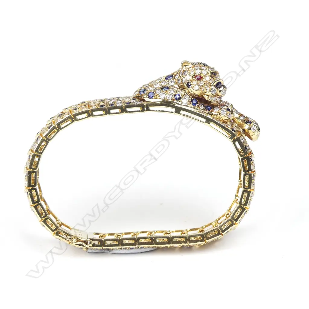 An impressive 18ct. gold diamond sapphire and ruby bracelet Image 1++