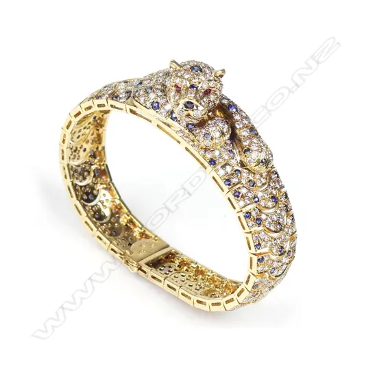 An impressive 18ct. gold diamond sapphire and ruby bracelet