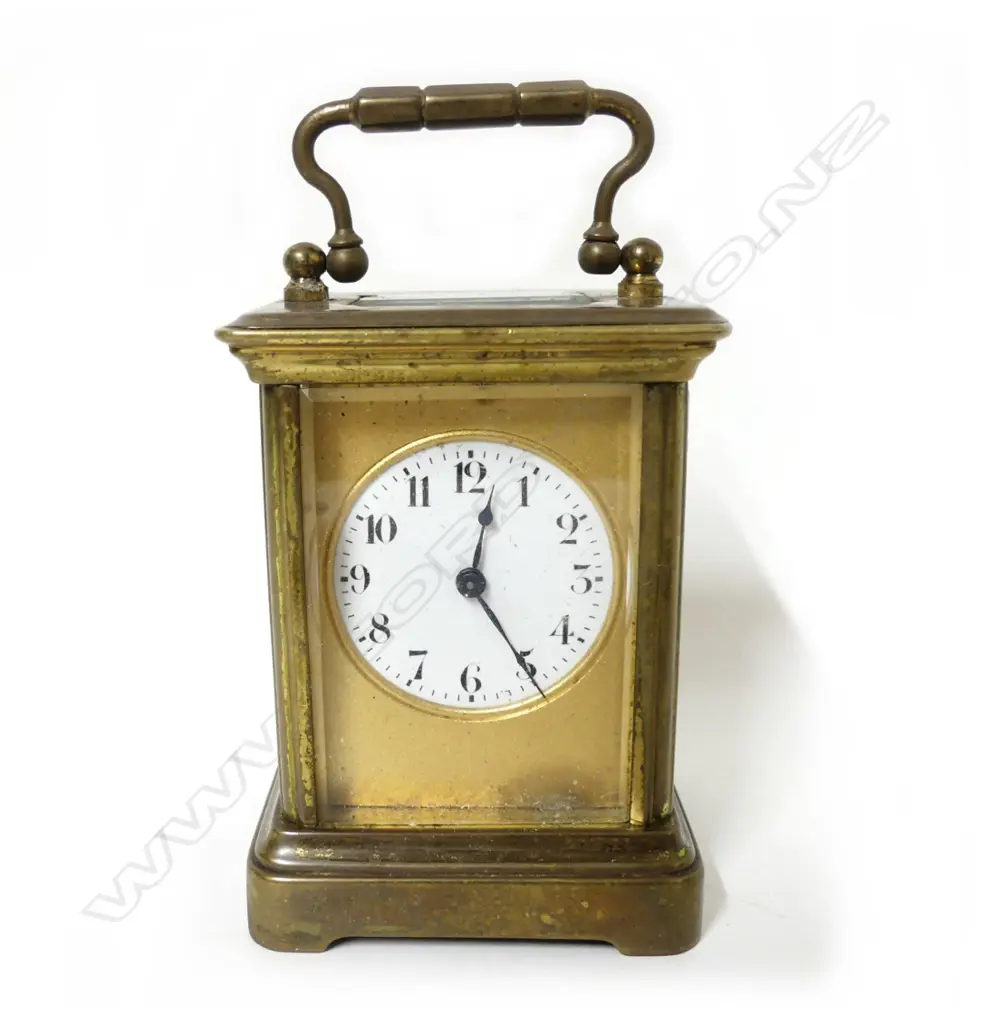 A small brass carriage clock Image 1++