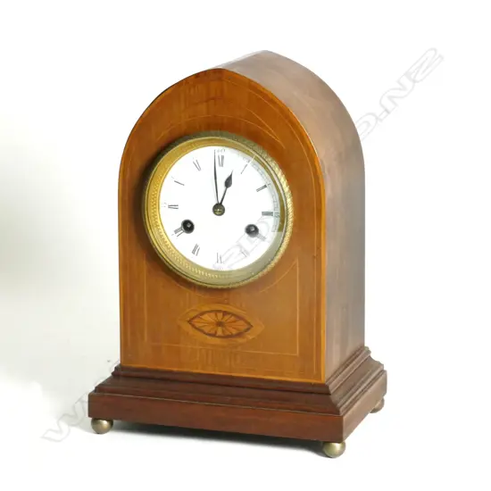 An Edwardian Sheraton Revival lancet clock