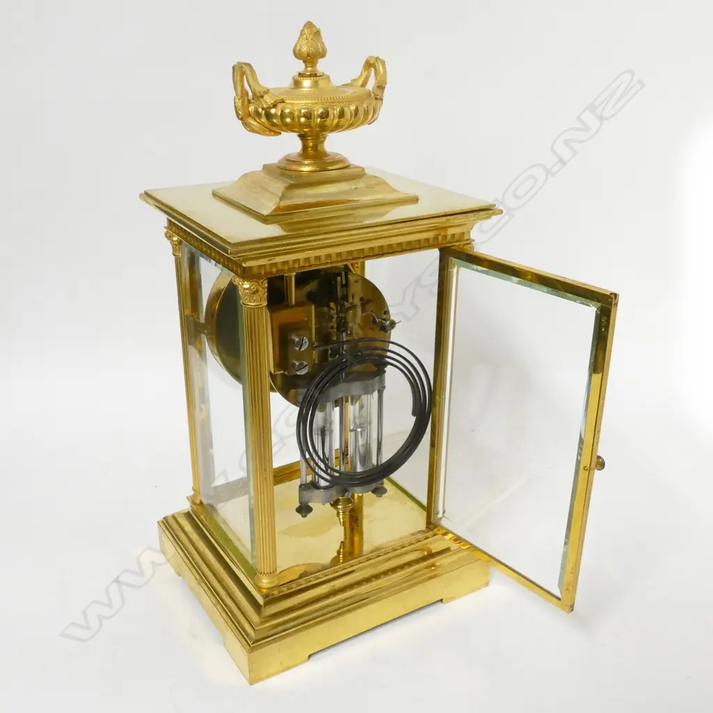 A French brass four glass two train mantel clock Image 1++
