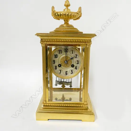 A French brass four glass two train mantel clock