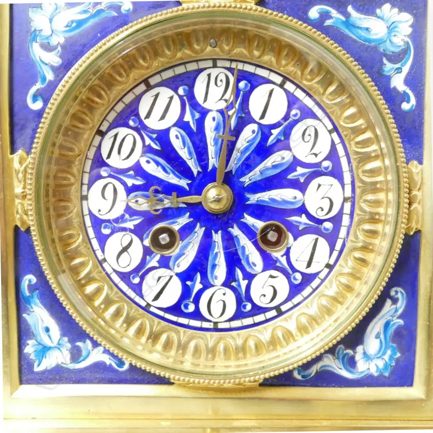 A decorative French mantel clock with blue and white porcelain panelled brass case Image 1++