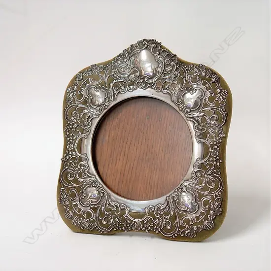 An Edwardian silver elaborate photo frame