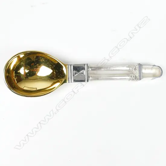 A small heavy silver spoon