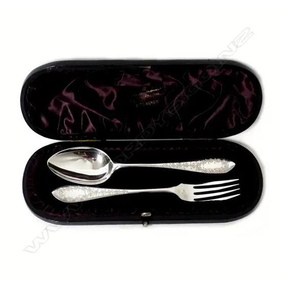 A boxed silver christening set