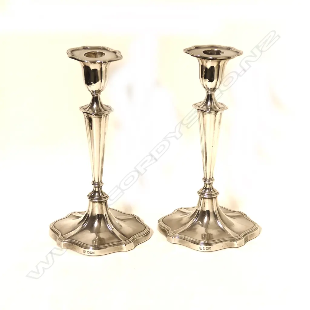 A pair of stylish 'Adam' style silver candlesticks Image 1++