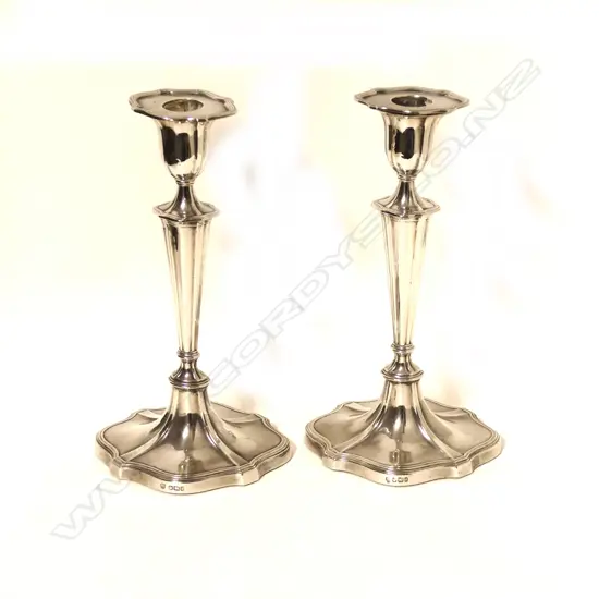 A pair of stylish 'Adam' style silver candlesticks