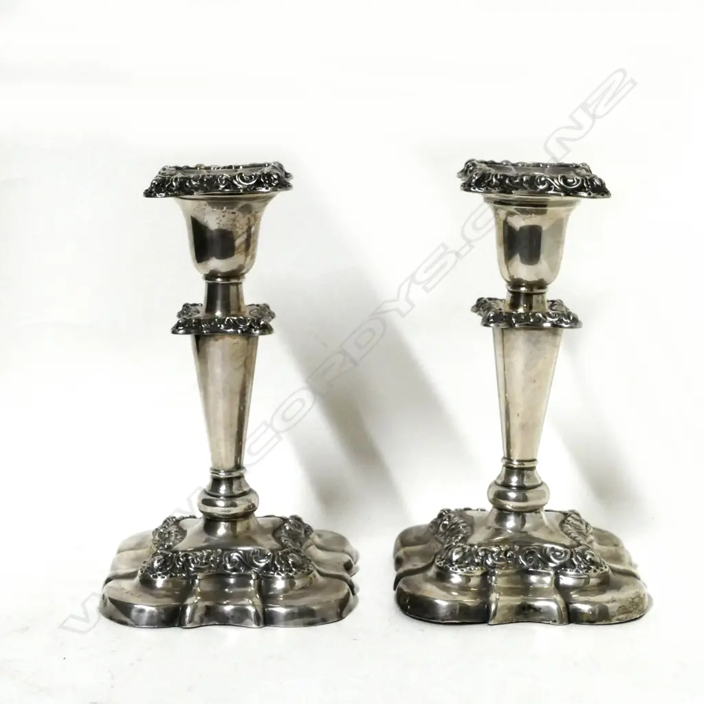 A pair of silver candlesticks Image 1++
