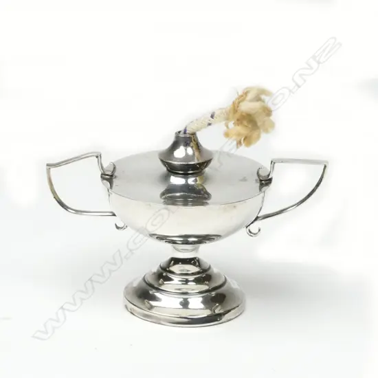 A small unusual oil lamp