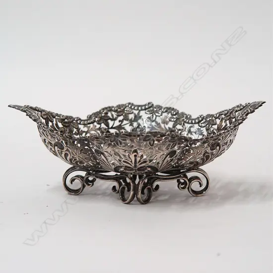 A heavy and decorative silver bonbon basket