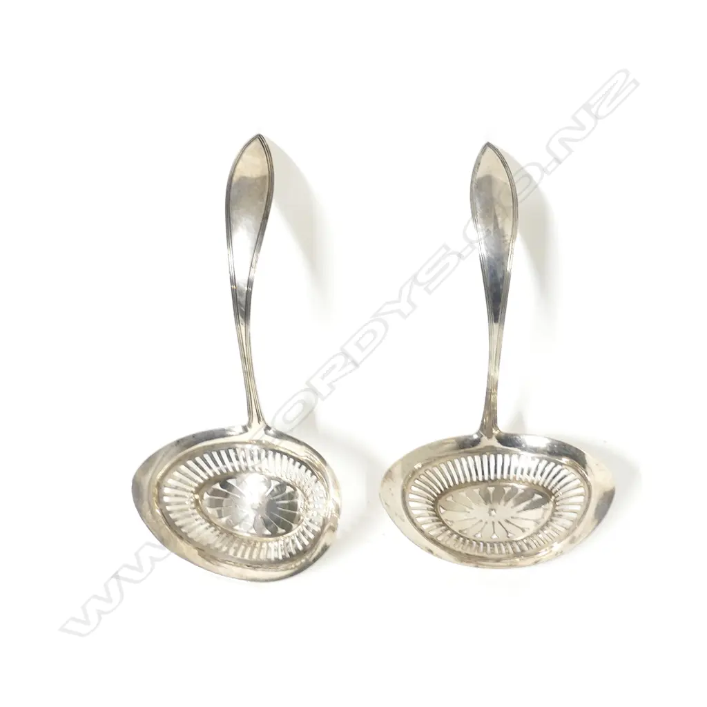 A pair of antique Dutch .833 standard silver sifting ladles Image 1++