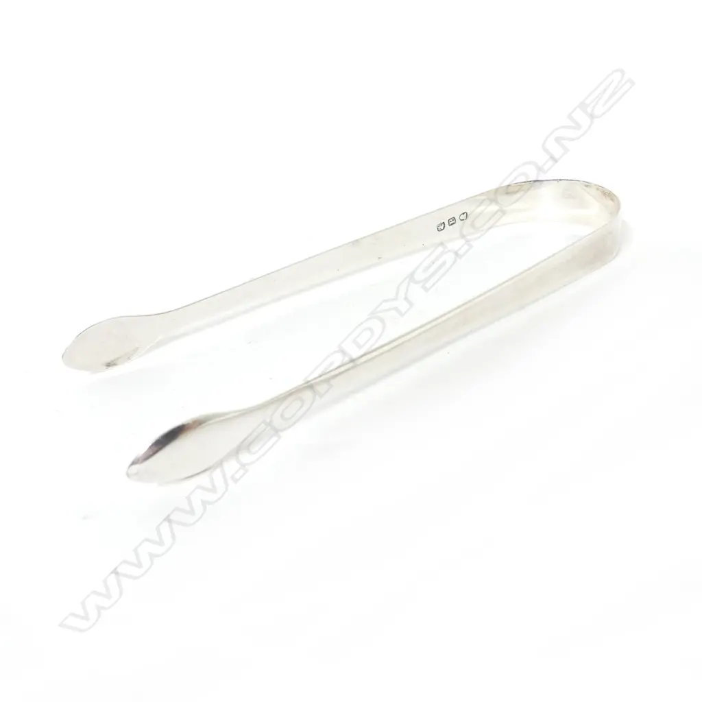 A pair of Georgian Old English silver sugar tongs Image 1++