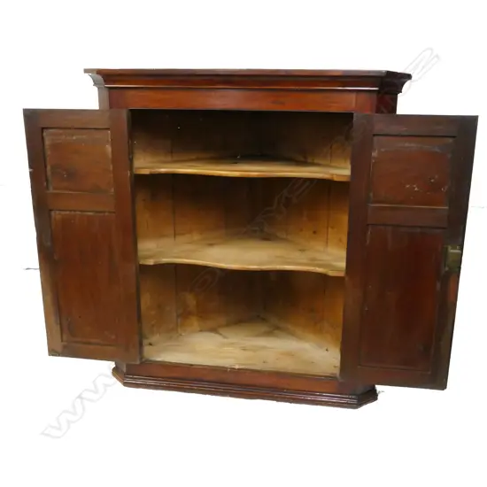 A Georgian mahogany corner cabinet