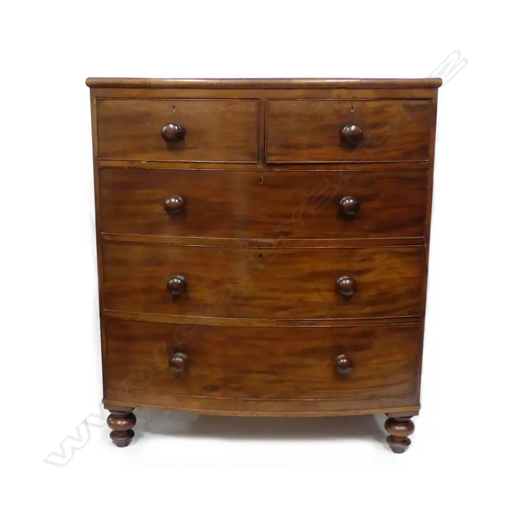 A Victorian mahogany bowfront five drawer chest Image 1++