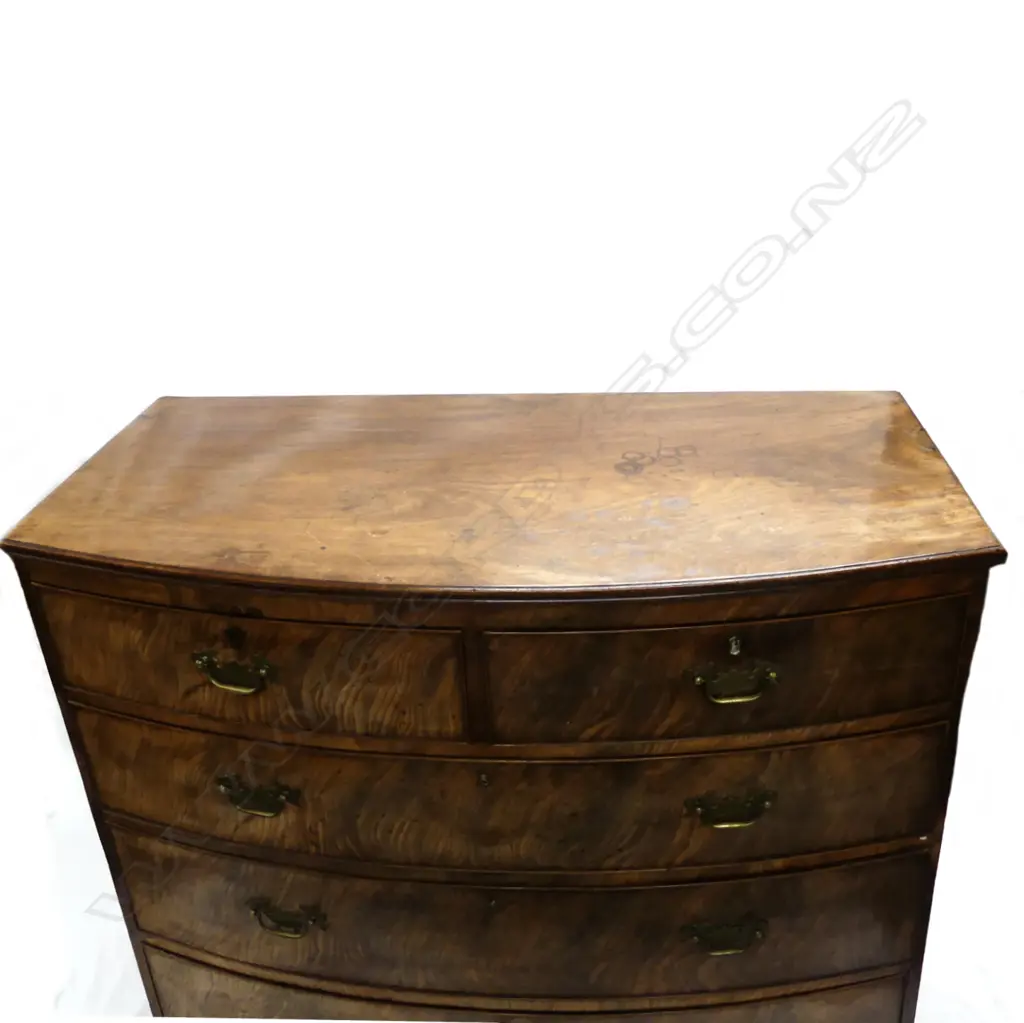 A Georgian mahogany bow-front five drawer chest Image 1++