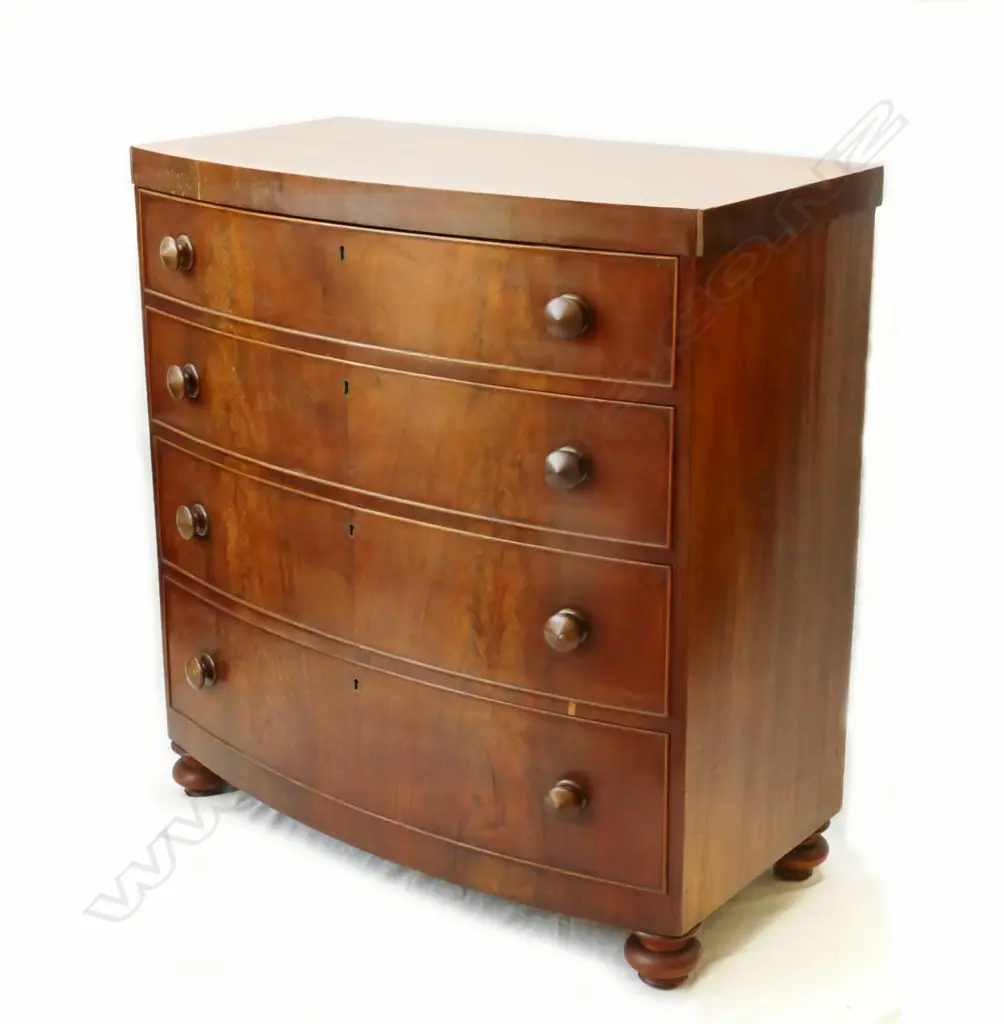 A Victorian mahogany bowfront four-drawer chest Image 1++