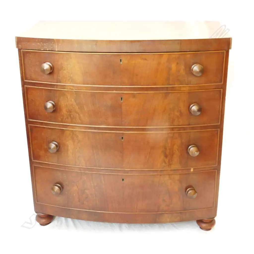 A Victorian mahogany bowfront four-drawer chest Image 1++