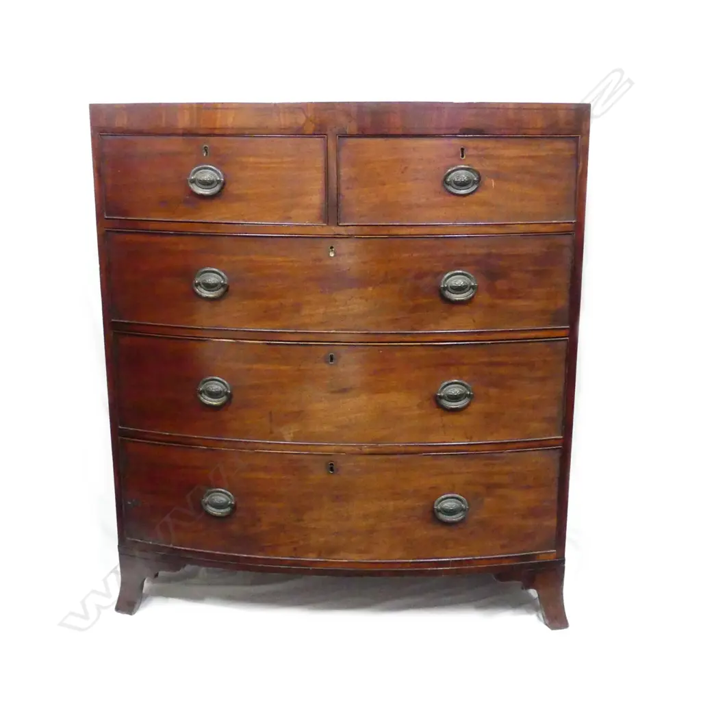 A Georgian mahogany bowfront five drawer chest Image 1++