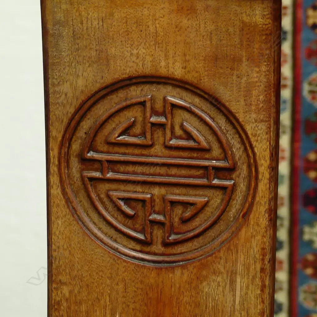 A Chinese rosewood dining table and six chairs Image 1++