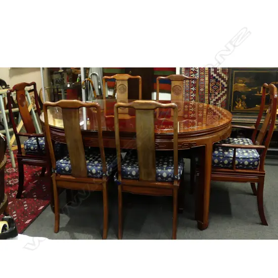 A Chinese rosewood dining table and six chairs