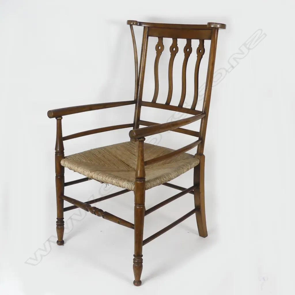 An unusual mahogany Arts & Crafts open elbow chair Image 1++