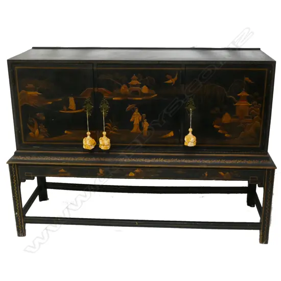 A black chinoiserie cabinet on stand