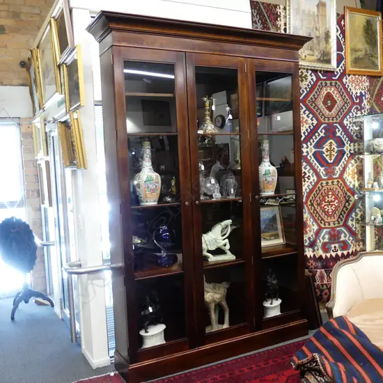 An impressive Sefton Powrie mahogany glazed bookcase